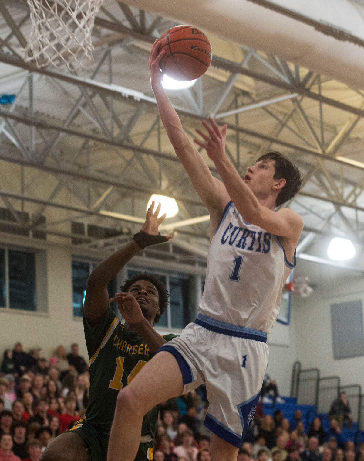 Curtis guard Tyce Paulsen (1) goes up for a layup during a Class 4A West Central/Southwest district basketball game against Kentridge on Saturday, Feb. 11, 2023 at Curtis High School in University Place, Wash.