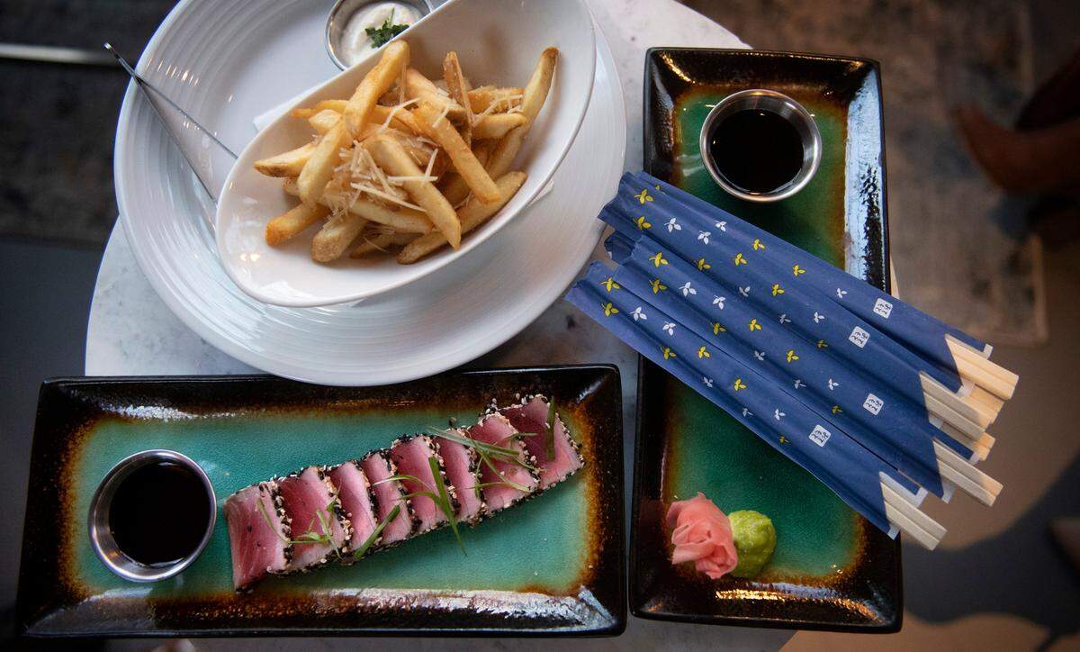 The happy hour menu at Stanford’s Tacoma includes seared ahi tuna encrusted with sesame and parmesan truffle fries, pictured here on Dec. 8, 2021.