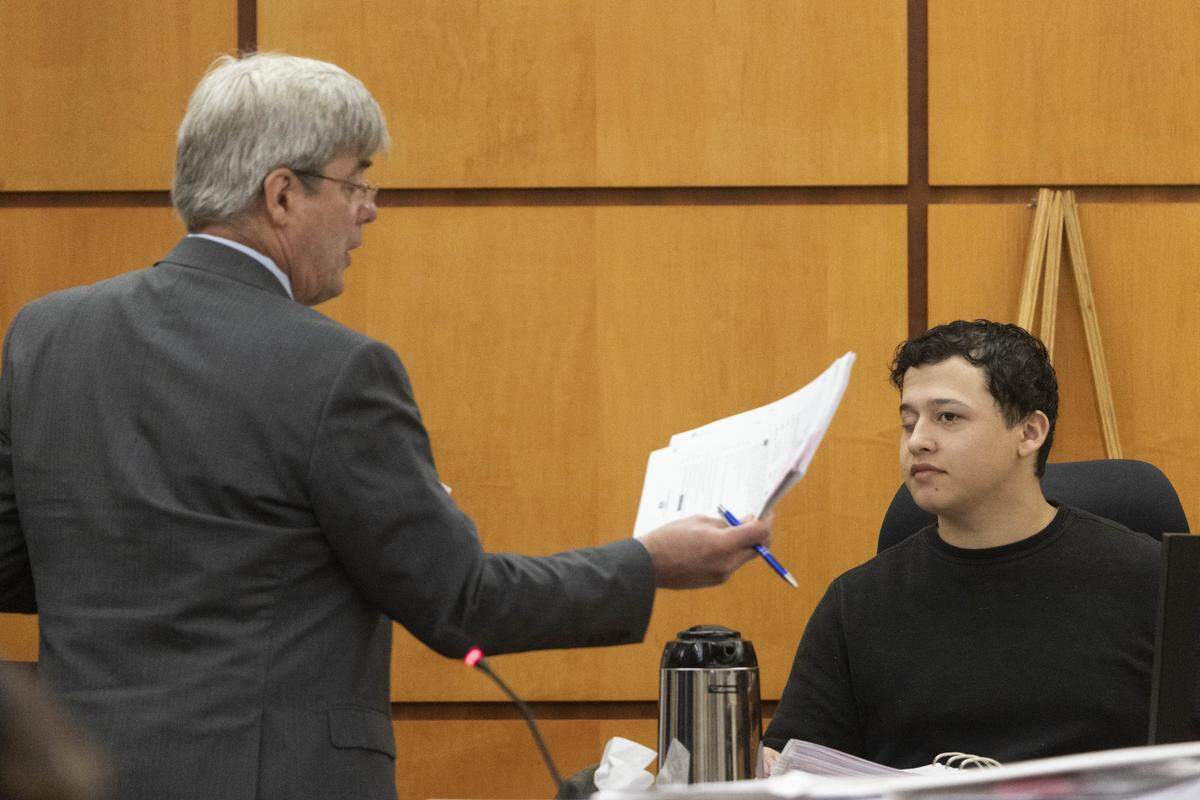 Defense attorney Wayne Fricke, left, cross examines Seth Cowden, a witness who filmed video of the beating and killing of Manny Ellis, in Pierce County Superior Court Wednesday, Oct. 18, 2023, in Tacoma, Wash. Tacoma Police Officers Christopher Burbank, Matthew Collins and Timothy Rankine are on trial for the killing of Manny Ellis on March 3, 2020. (Ellen M. Banner / Pool / The Seattle Times)
