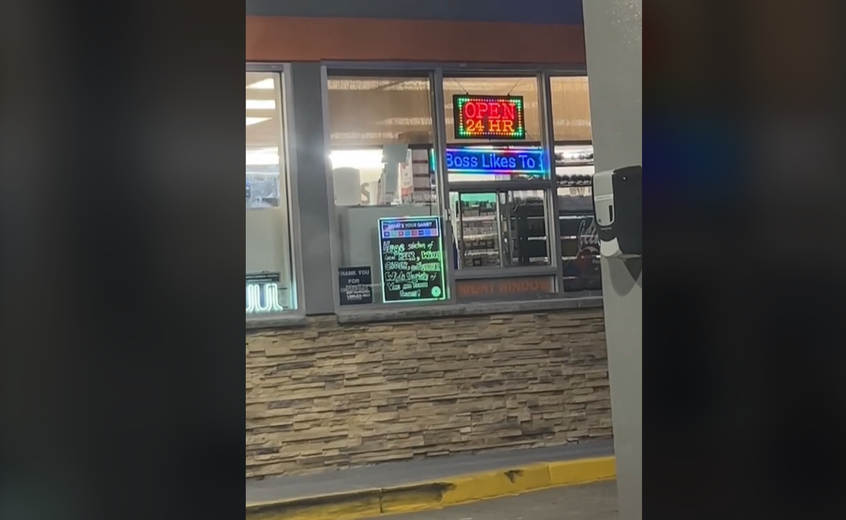 A screenshot of the TikTok video showing the LED ticker sign in the window on Aug. 11. The ticker, under the “open 24 hr” sign above it, has since been removed.