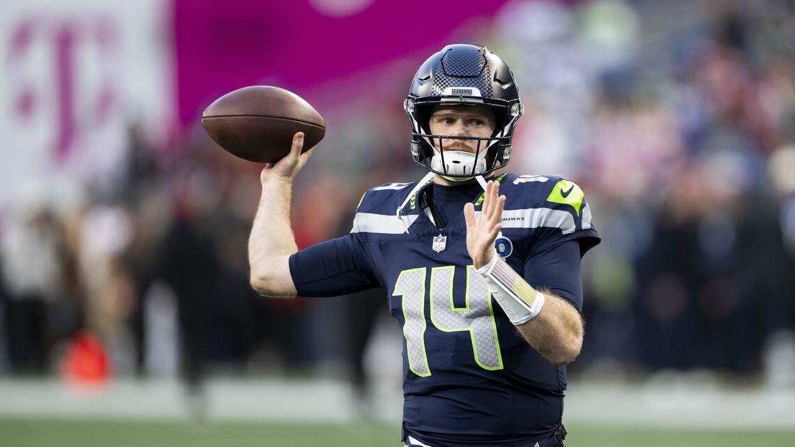 Sam Darnold on the field throwing as usual Seahawks pregame for 49ers playoff