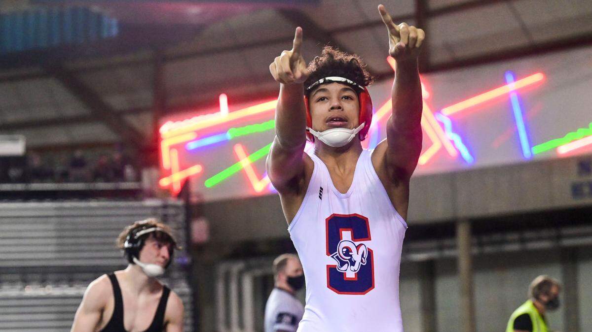 Silas’ Elijah Cater celebrates after beating University’s Tyler Walker 120-pound 3A championship match at Mat Classic XXXIII on Saturday, Feb. 19, 2022, at the Tacoma Dome in Tacoma, Wash. Cater pinned Walker in 2 minutes, 45 seconds.