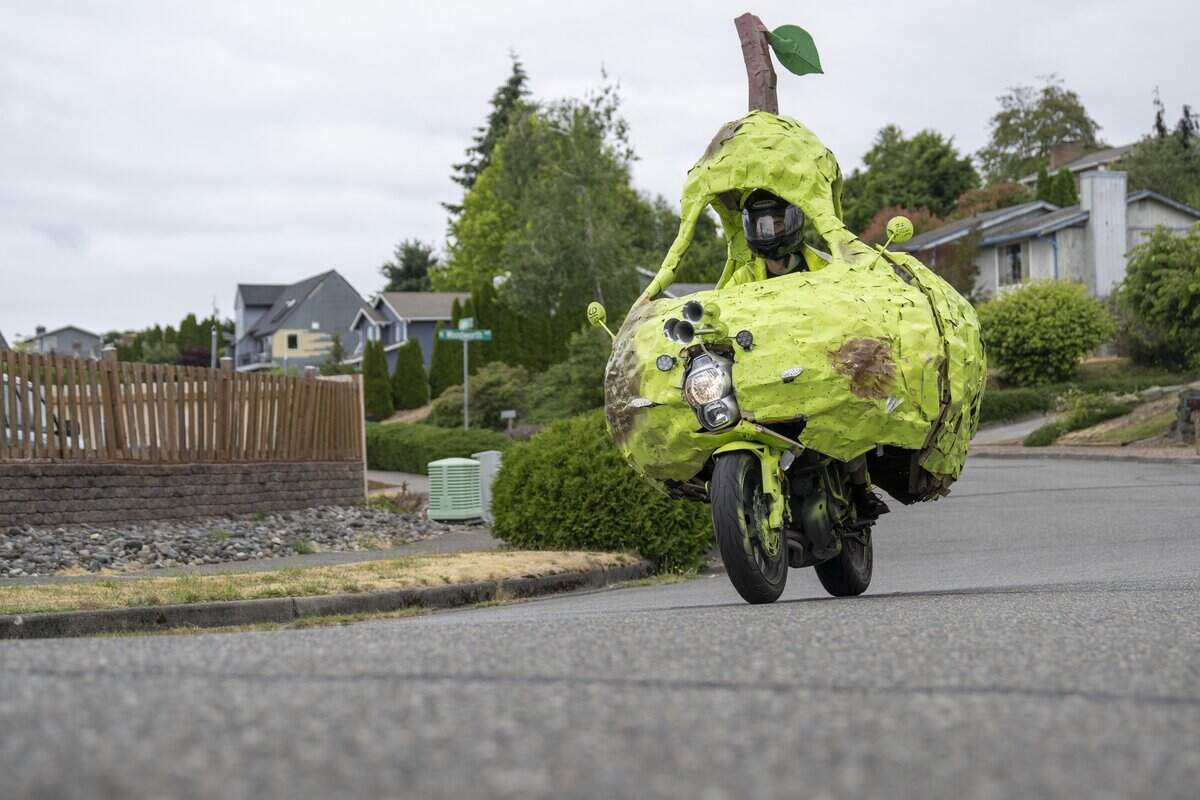 Andrew Glubbey drives the Pear Car down a Tacoma road on Wednesday, July 8, 2026, in Tacoma, Wash.