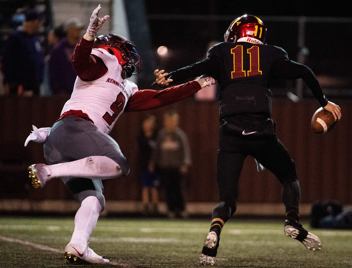 Kennedy Catholic’s Sav’ell Smalls sacks Cameron Brauer. Kennedy Catholic played Enumclaw in a football game at the Enumclaw Expo Center in Enumclaw, Wash., on Friday, Oct. 4, 2019.