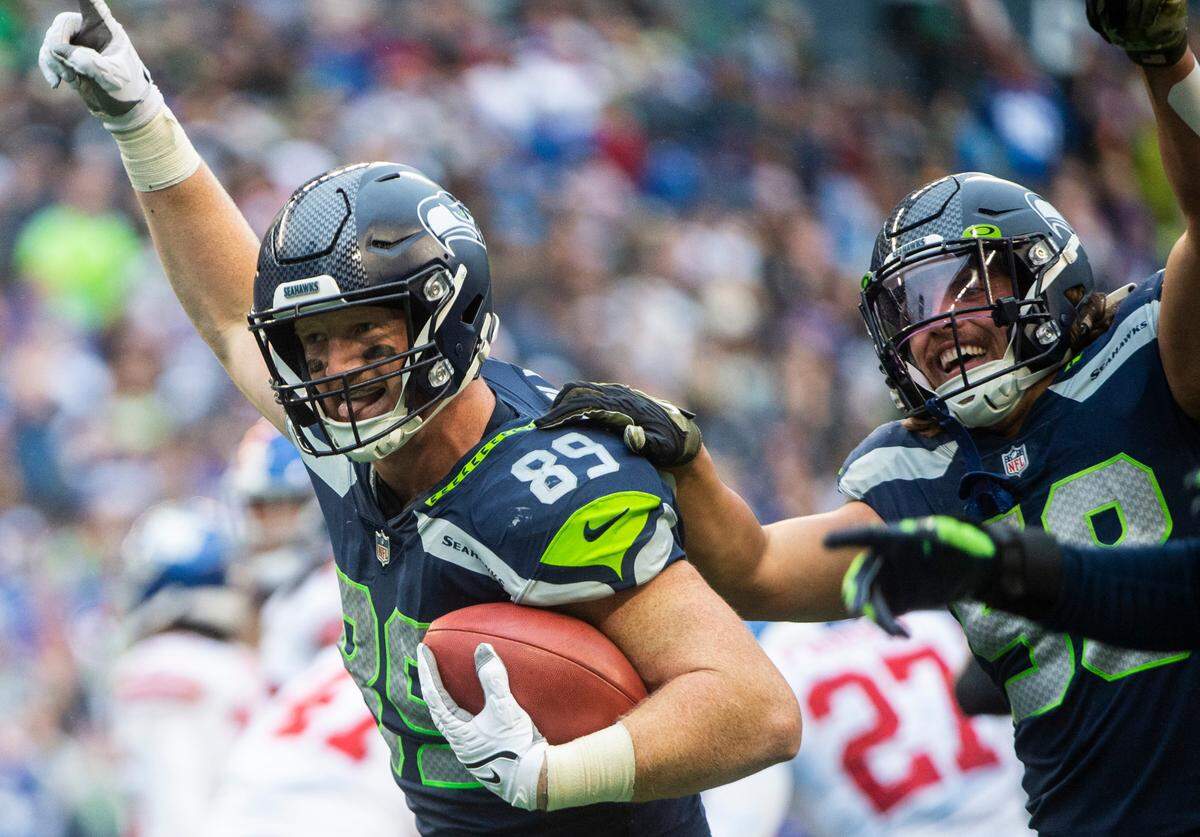 Seattle Seahawks tight end Will Dissly (89) celebrates after intercepting the ball in the fourth quarter of an NFL game at Lumen Field in Seattle, Wash. on Oct. 30, 2022. The Seahawks defeated the Giants 27-13.
