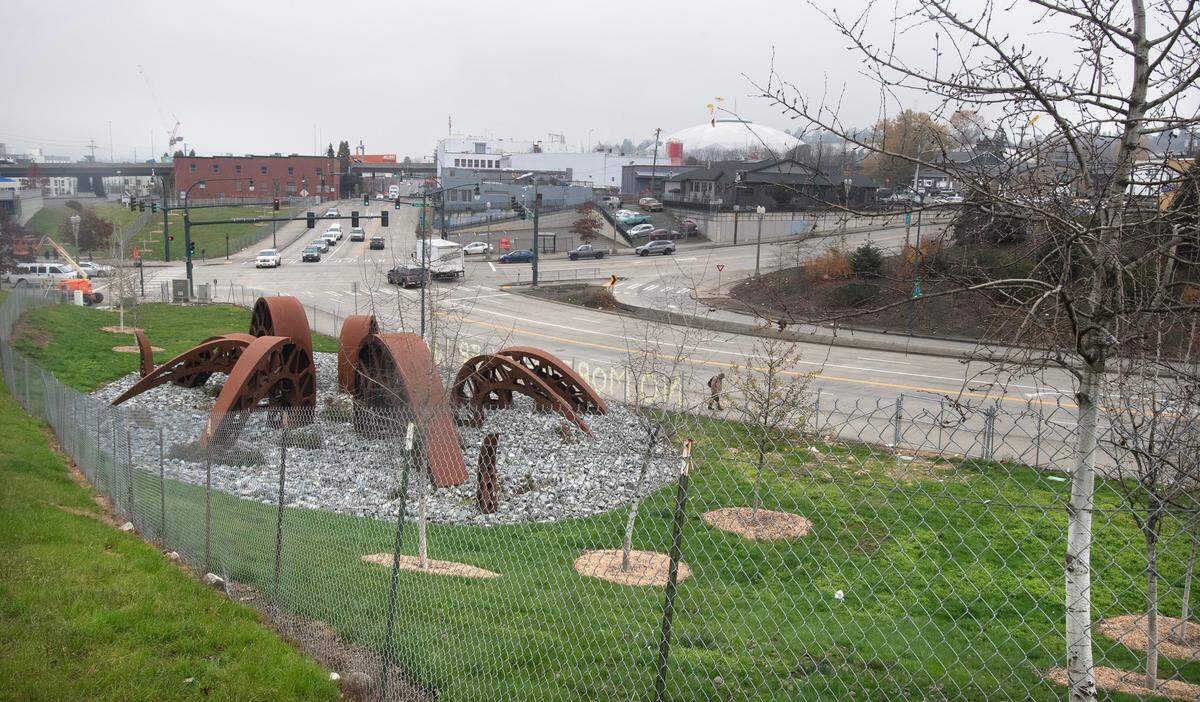 The “Gertie’s Ghost” sculpture park next to Sound Transit’s railroad line in downtown Tacoma, Washington, has been fenced in since its installation in 2019. The city says it’s to protect the young trees planted there, shown on Wednesday, Dec. 4, 2024, as well as protect the sculpture from vandalism.