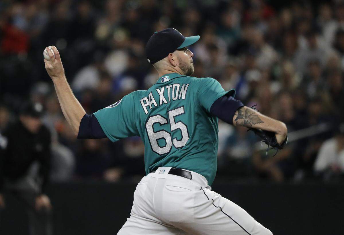 Seattle Mariners starting pitcher James Paxton throws to a New York Yankees batter during the first inning of a baseball game Friday, Sept. 7, 2018, in Seattle. (AP Photo/Ted S. Warren)