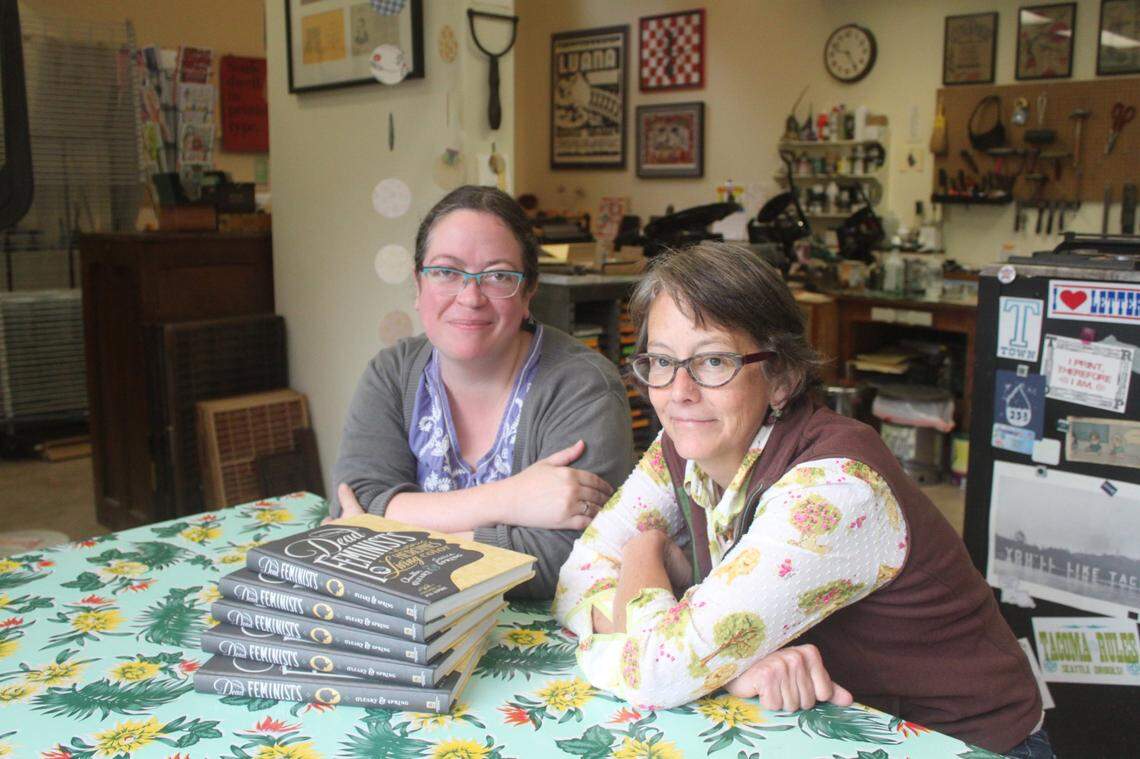 Illustrator Chandler O’Leary, left, and letterpress artist Jessica Spring celebrating the 2016 launch of their book “Dead Feminists.”
