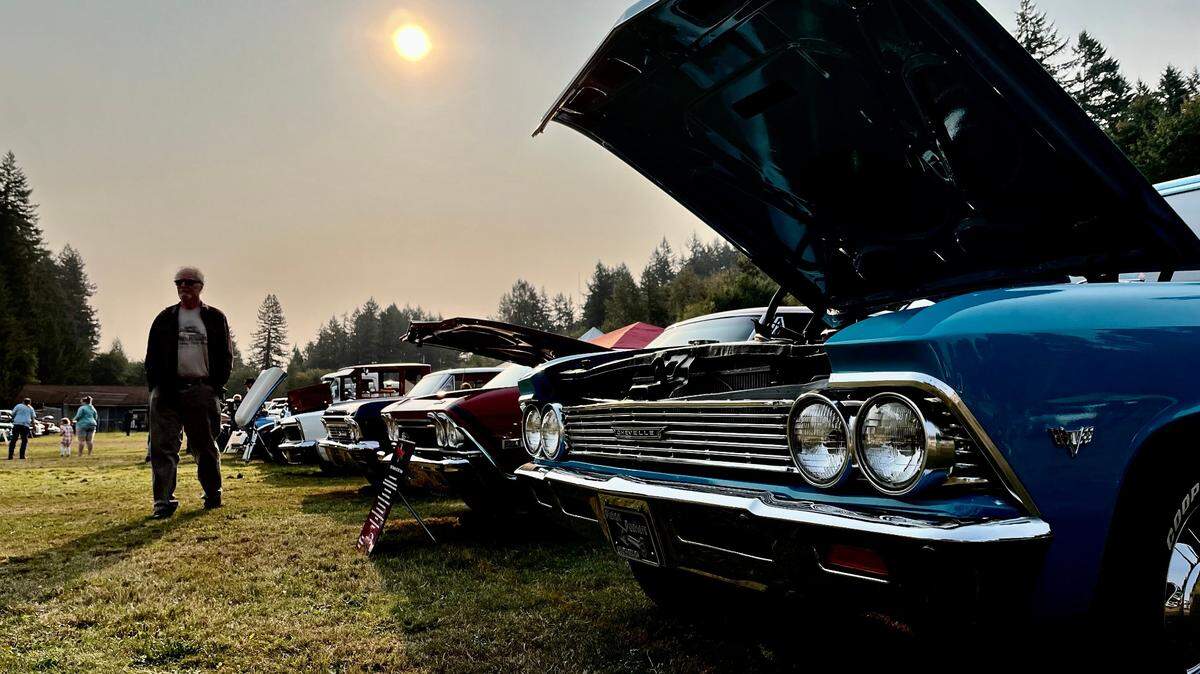 Smoke from regional fires in Washington and Canada cast a light haze over the T-9-O Quarrymen’s 21st Annual Car show in Tenino City Park early Sunday, Aug. 20, 2023. Earlier an air quality alert was issued by the National Weather Service regionally which is set to expire at noon on Monday.