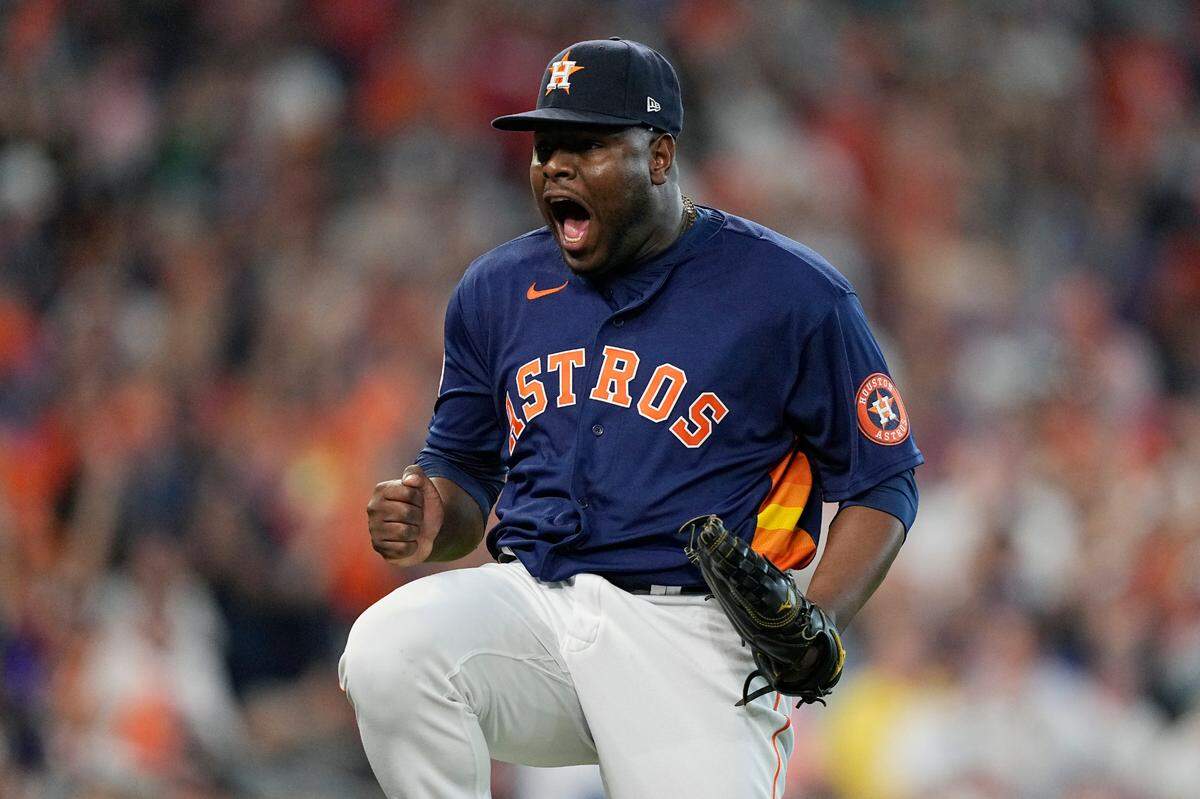 Houston Astros pitcher Hector Neris reacts after the third out against the Seattle Mariners during the sixth inning in Game 2 of an American League Division Series baseball game in Houston, Thursday, Oct. 13, 2022. (AP Photo/David J. Phillip)