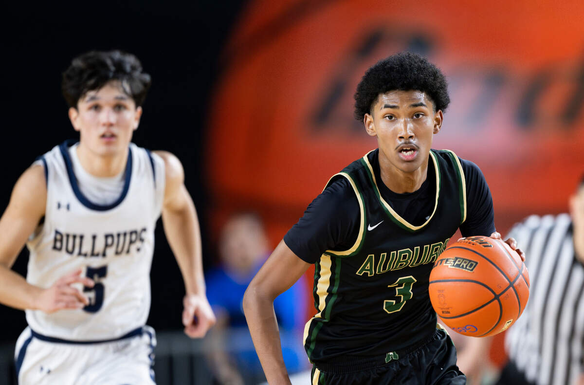 Auburn’s Daniel Johnson (3) dribbles down court against Gonzaga Prep during the second half of a Class 4A state basketball tournament quarterfinal game at the Tacoma Dome on Thursday, March 6, 2025, in Tacoma, Wash.
