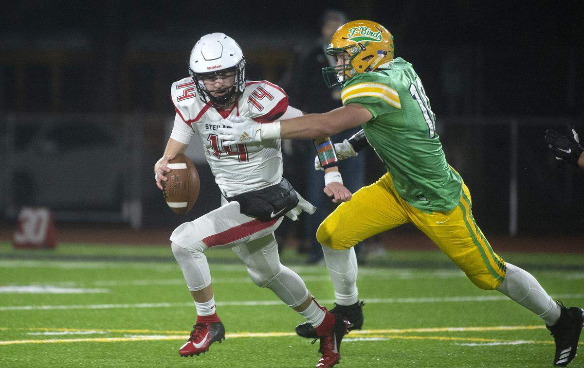 Tumwater defensive end Ryan Otton sacks Steilacoom quarterback Chance McDonald during the T-Birds’ 48-34 victory over the Steilacoom Sentinels in Saturday’s 2A football state championship game at Sparks Stadium in Puyallup on Dec. 7, 2019.