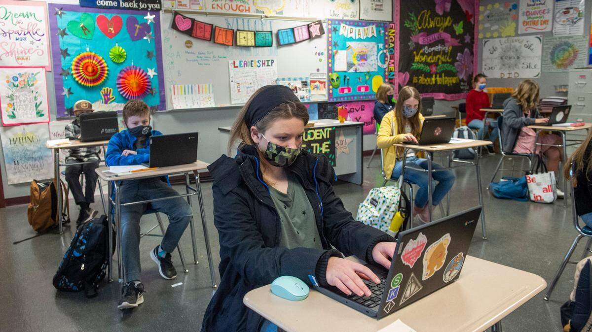 Students spaced 6-feet apart work on their laptops in Debra Kaiser’s Leadership class at Goodman Middle School. Sixth-graders returned Feb. 25 to the Peninsula School District’s four middle schools for hybrid in-person learning.