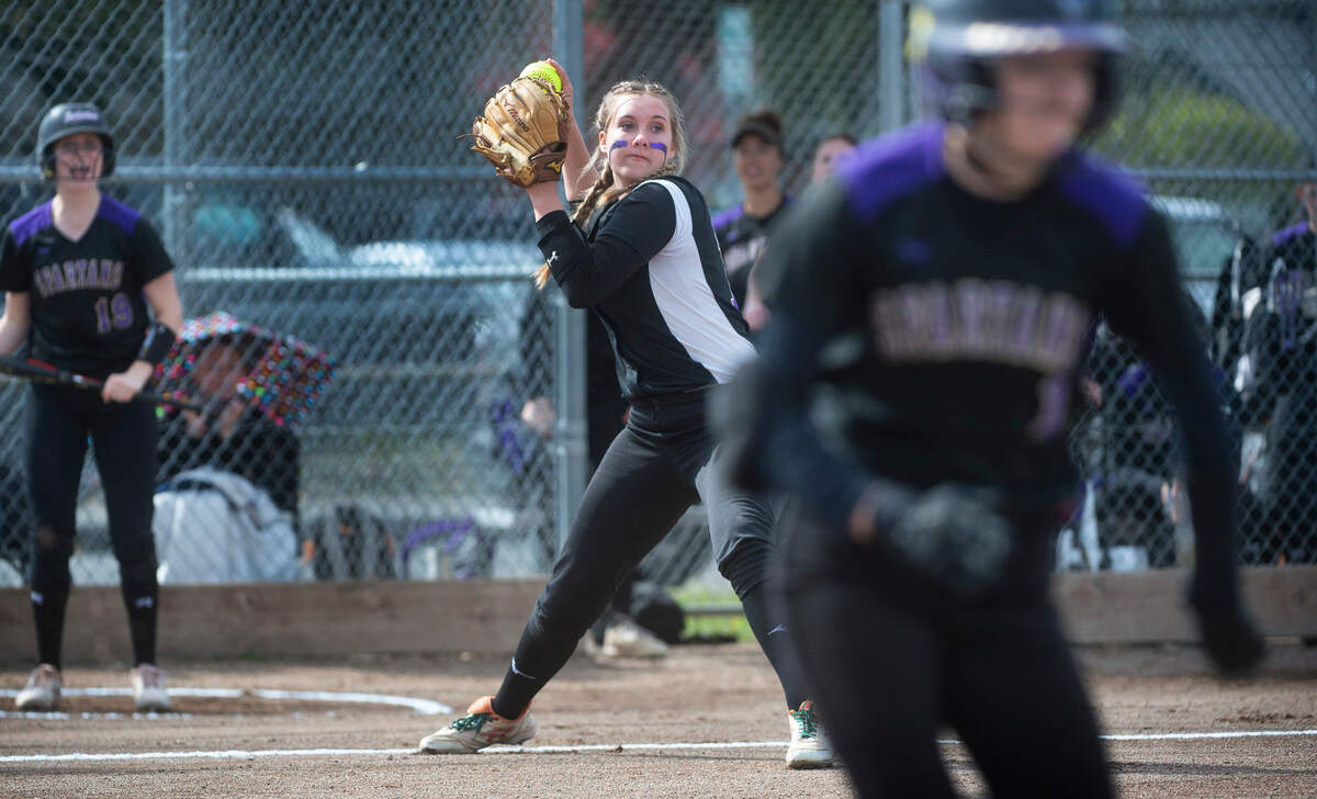 Puyallup third baseman Kyra Smith fires to first base during the Vikings’ fastpitch game against the Sumner Spartans at Puyallup High School in Puyallup, Washington, on Wednesday, April 27, 2022.