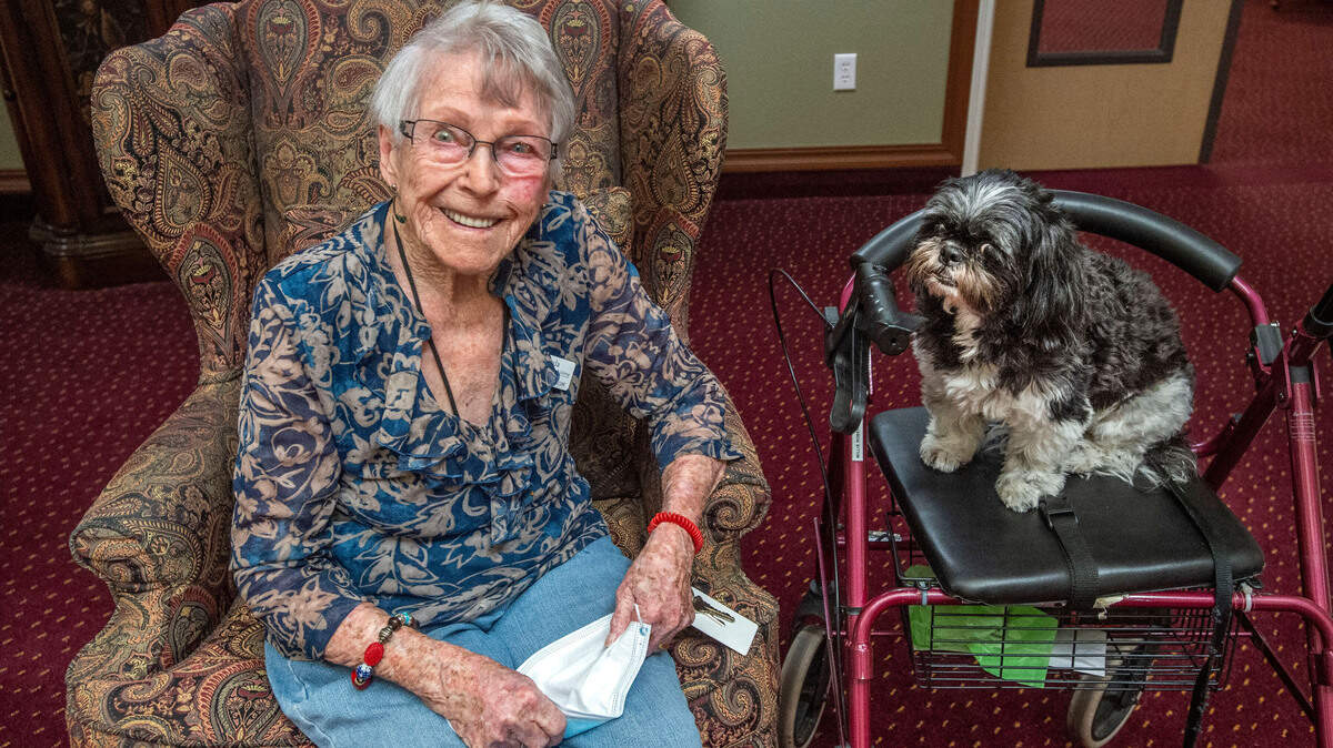 Millie Robertson and her companion, Chloe. Millie, now 102, ran a crane at the Bremerton Navy Yard during World War II.