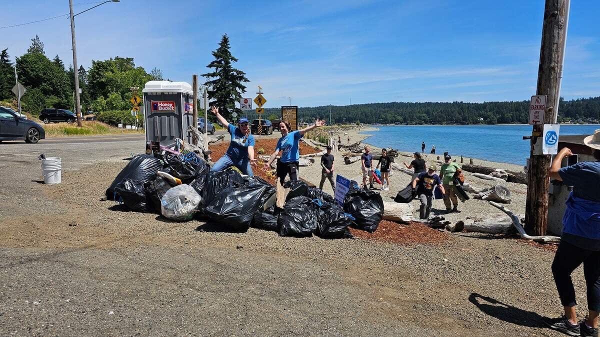 This shows volunteers with Surfrider’s South Sound chapter collecting trash after the Fourth of July in Gig Harbor.