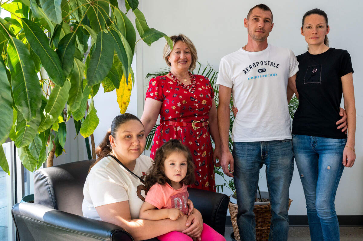 Uliana Horniak and her daughter Veronika (left) immigrated to the United States from Ukraine in April, 2022, shortly after Russian forces attacked the country. While she misses Ukraine and her friends and family, she would like to stay in the U.S. to provide a better, safer life for Veronika. Photographed at Tacoma Community House on Wednesday, Aug. 24, 2022 along with Svetlana Waer, an immigration specialist at Tacoma Community House, and Victor Kovaliou and his wife Dana, who also immigrated to the U.S. from Ukraine earlier this year.