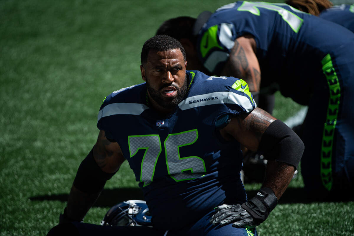 Duane Brown stretches before the game. The Seattle Seahawks played a mock game at CenturyLink Field in Seattle, Wash., on Wednesday, Aug. 26, 2020.