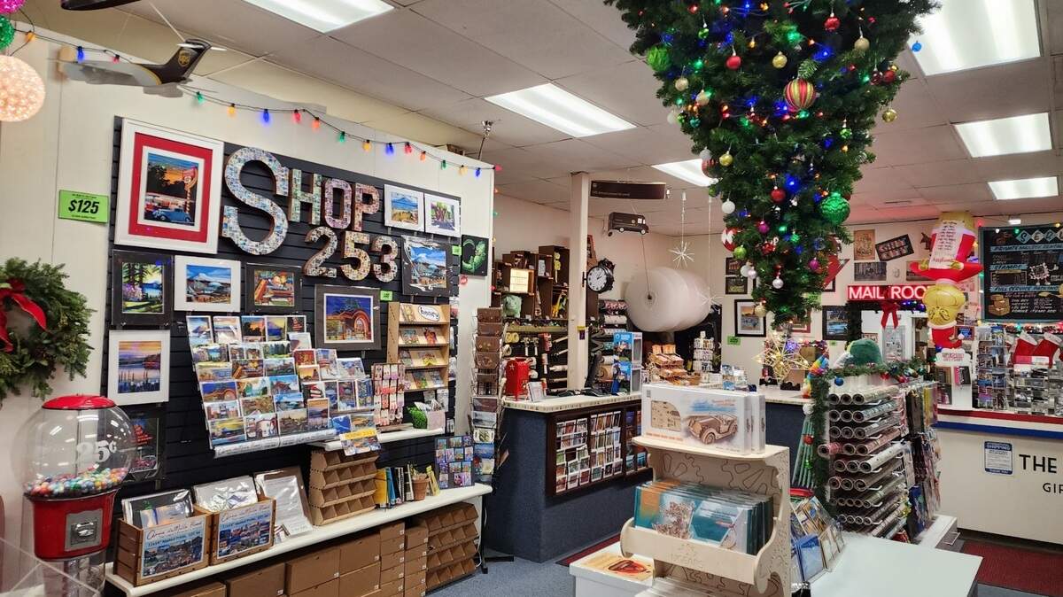 A Christmas tree hanging from the ceiling is part of the one-of-a-kind interior at The Mail Room Gift & Ship Co., 6824 19th St. W. in University Place.