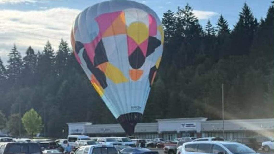 Hot air balloon pilot lands along Pierce Co. highway, parallel parks at Costco