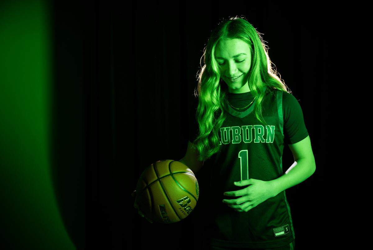 Auburn’s Avery Hansen poses for a portrait after being selected as The News Tribune’s 2023 All-Area basketball first team, at Silas High School, on Sunday, March 17, 2024 in Tacoma, Wash.
