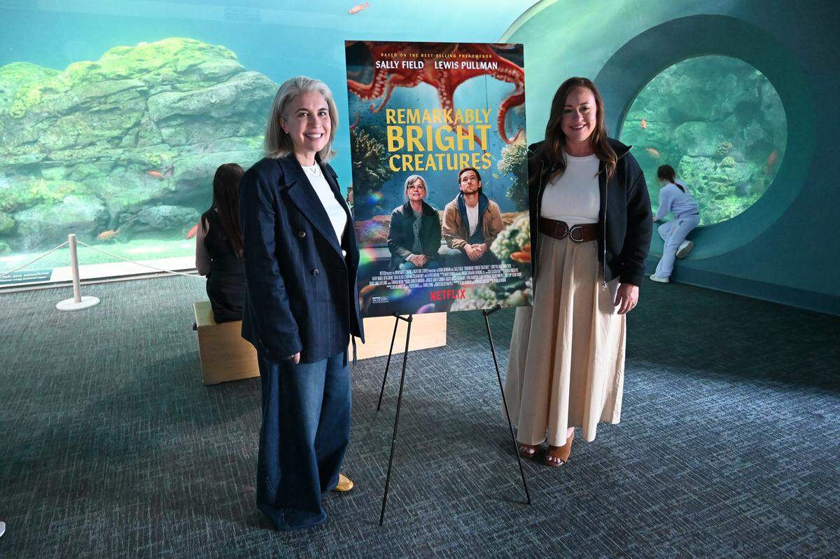 Writer Shelby Van Pelt and director Olivia Newsom at the Point Defiance Aquarium on the eve of the release of their Netflix movie Remarkably Bright Creatures.