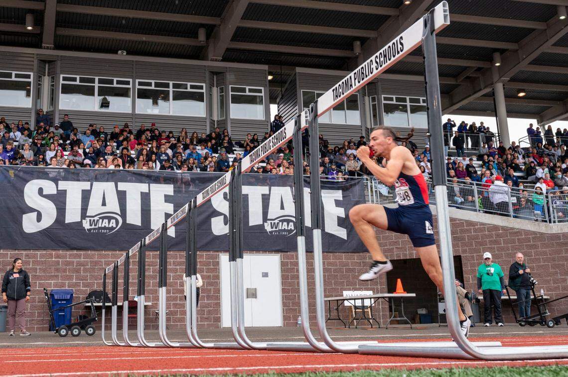 Silas’ Jaylen McCabe prepares to leap over a hurdle during the first heat of the 3A 110-hurdles at the State 2A, 3A, 4A track and field championships on Thursday, May 26, 2022, at Mount Tahoma High School in Tacoma Wash. McCabe finished the prelims with the fastest time, 14.13 seconds.