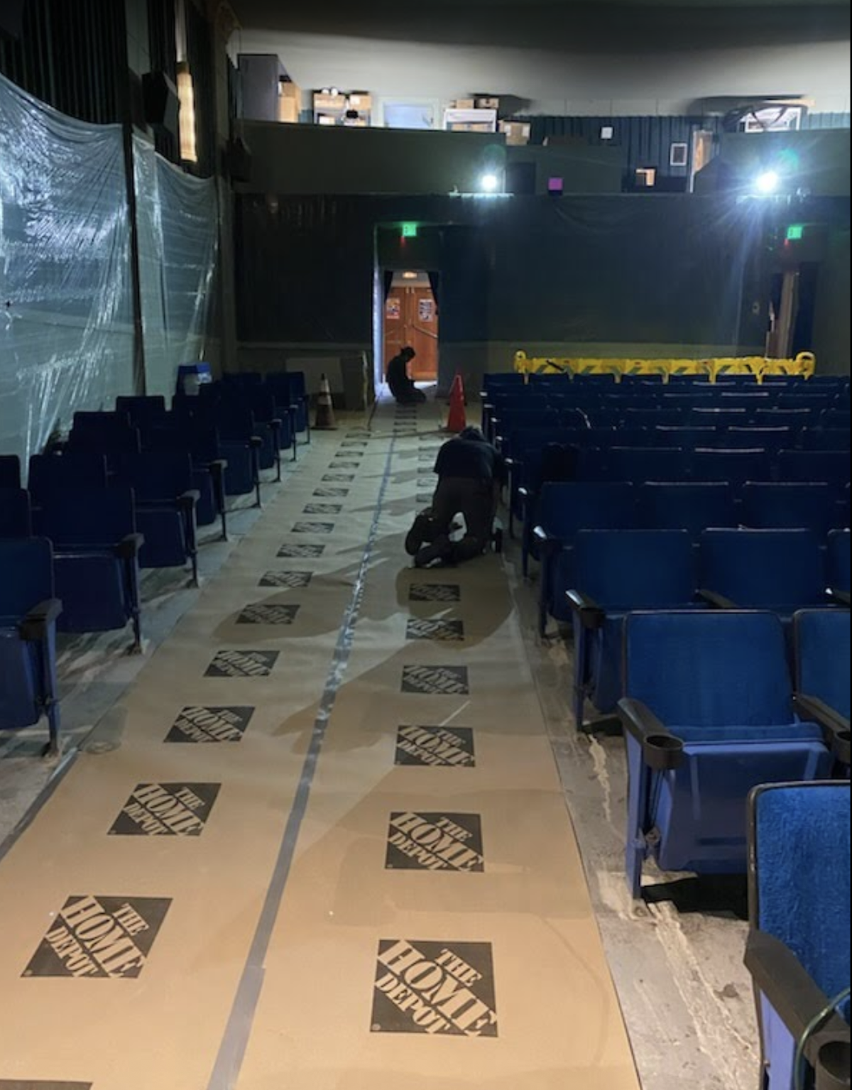 The inside of the Blue Mouse Theatre for now is a construction zone, with workers focused on flooring improvements and seat removal/replacement.