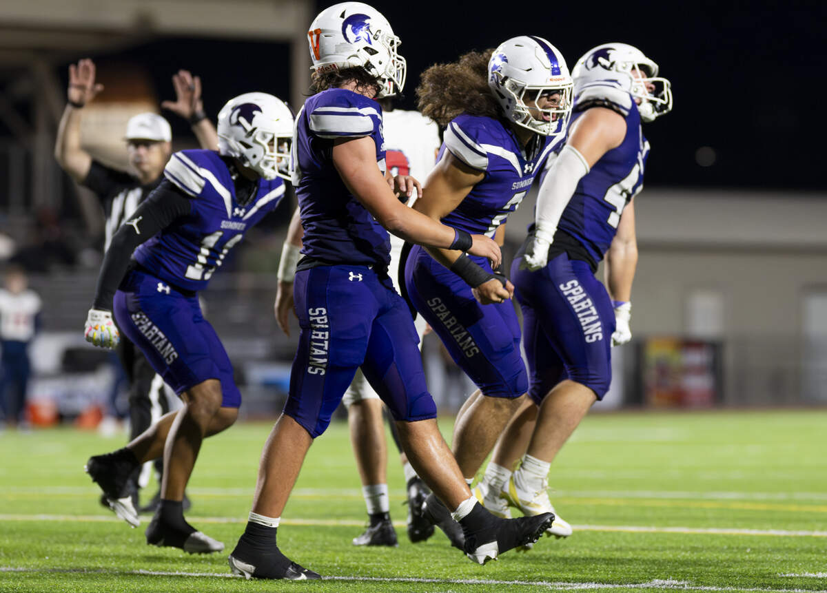 The Sumner Spartans react to a stop against Kennedy Catholic Lancers during the second half of the game at Sunset Chev Stadium on Friday, Sept. 12, 2025, in Sumner, Wash.