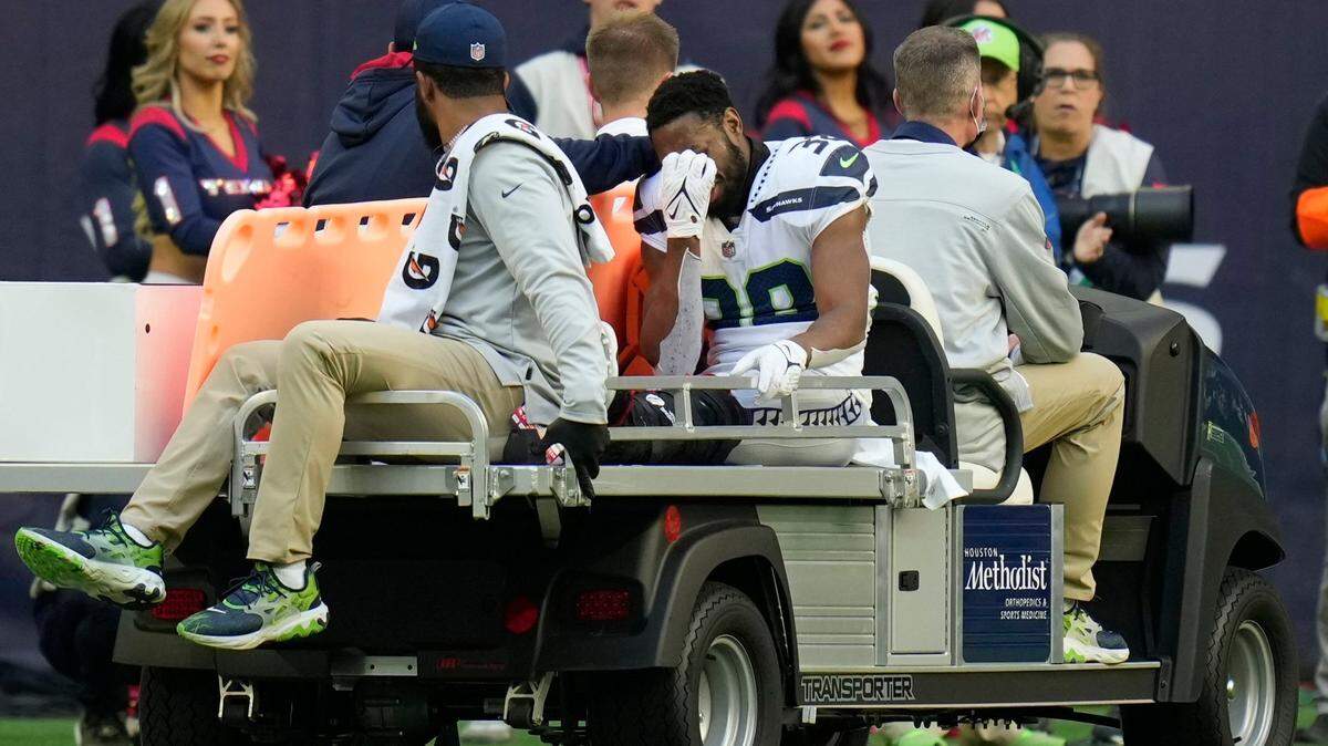 Seattle Seahawks defensive back Gavin Heslop (38) is taken off the field after and injury during the second half of an NFL football game against the Houston Texans, Sunday, Dec. 12, 2021, in Houston. (AP Photo/Eric Christian Smith)