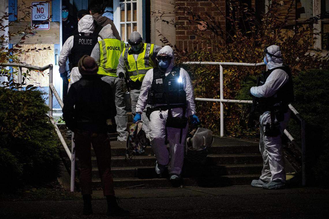 Police remove people’s belongings from Gault middle school after a housing advocacy group occupied the abandoned building for most of the day. Photographed in Tacoma, Wash., on Friday, Nov. 20, 2020.