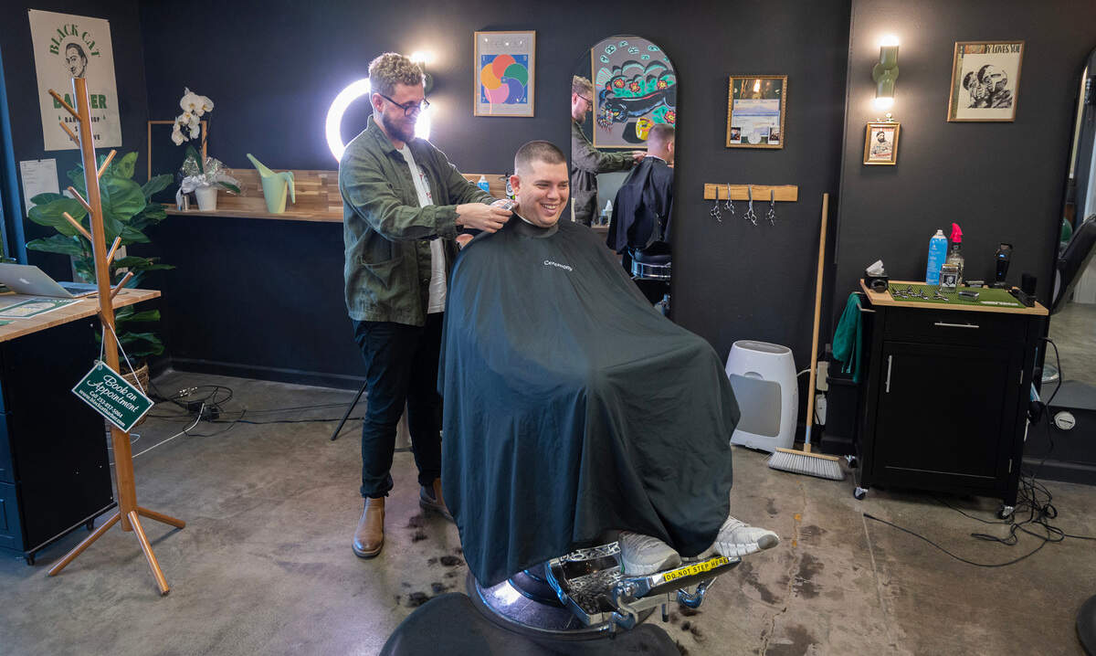 Owner Stewart Wentworth chats with Will Tucker of Tacoma during his haircut at Black Cat Barbershop & Salon in Gig Harbor, Washington, on Tuesday, Nov. 7, 2023.