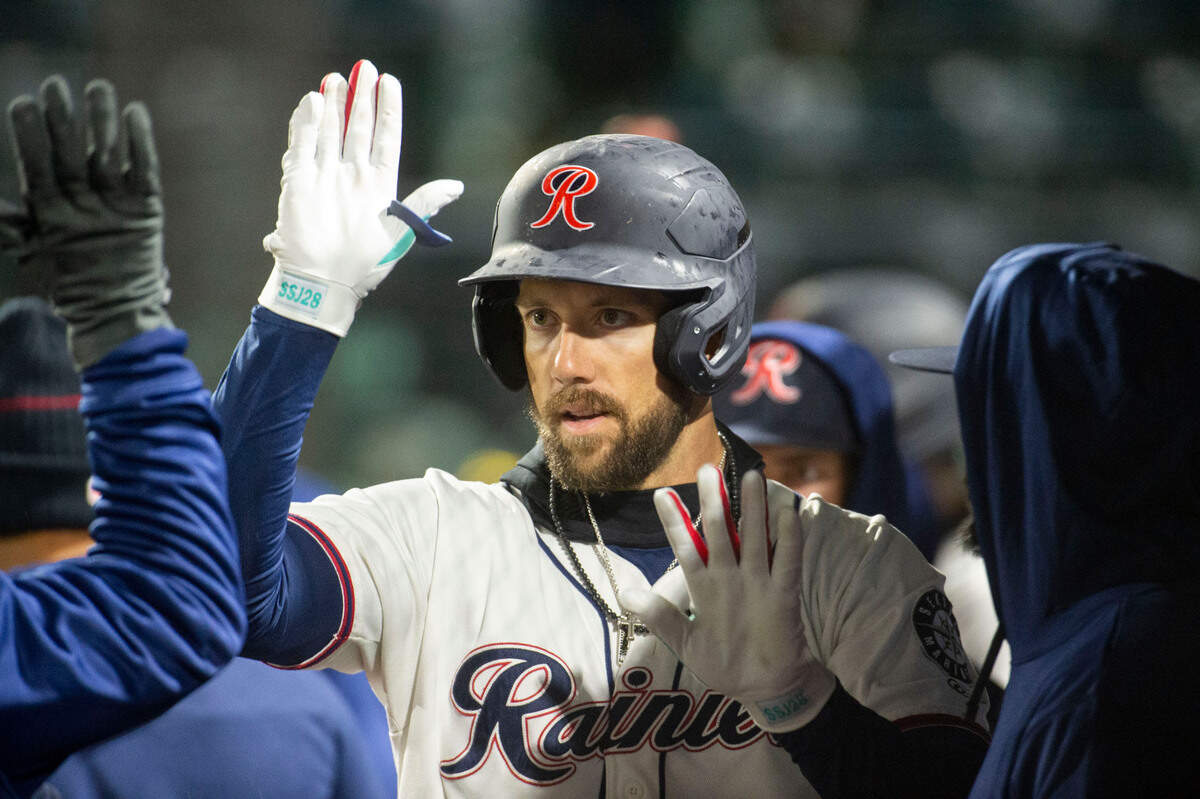 Tacoma Rainiers Steven Souza Jr. gets high-fives after a solo-home run to left field to lead off the bottom of the eighth inning of a Pacific Coast League game against the Sugar Land Space Cowboys on Thursday, April 21, 2022, at Cheney Stadium in Tacoma, Wash.
