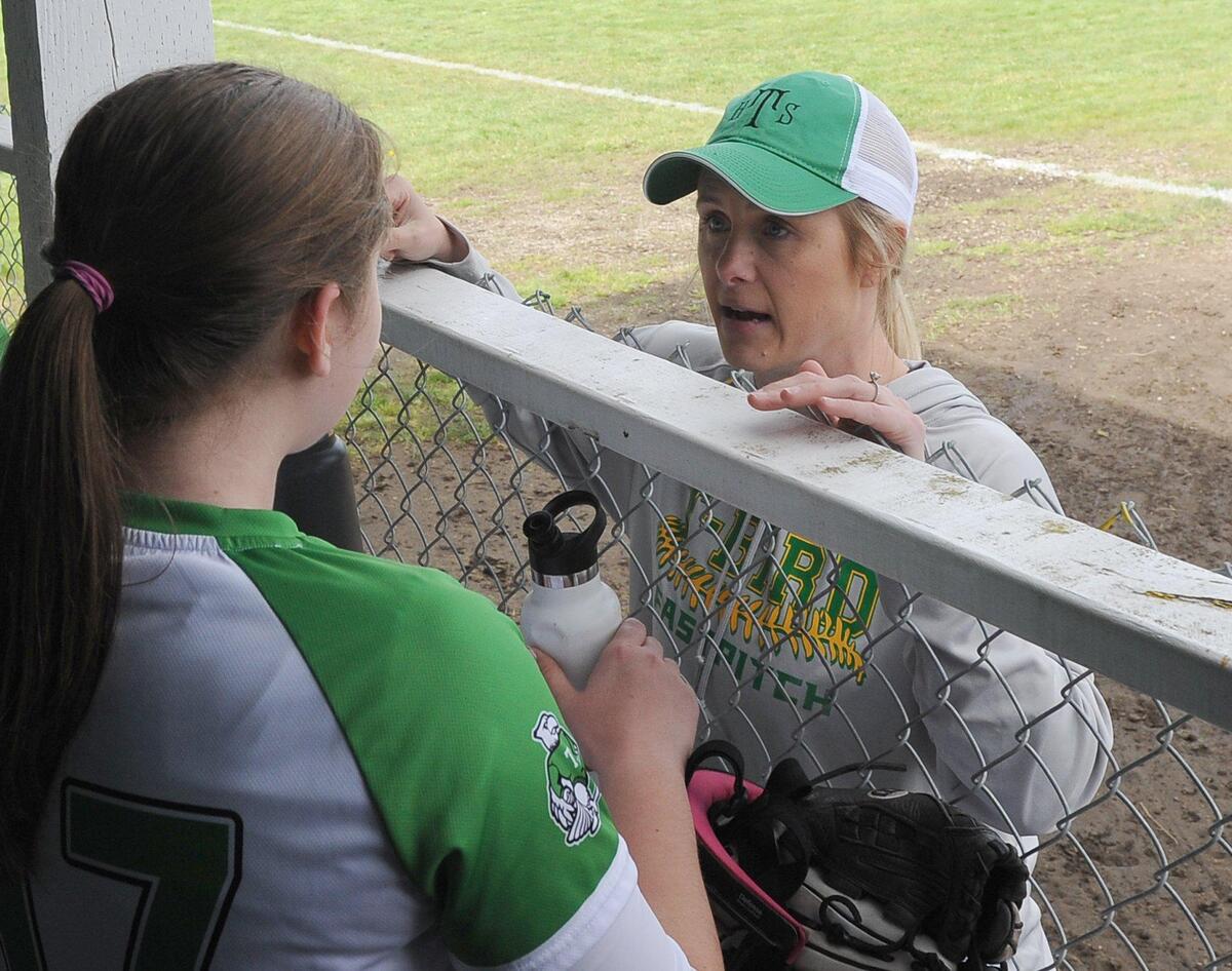 Head coach Ashley Andrews talks with pitcher Haley Stewart in between innings during the T-Birds’ April 27 home game against Centralia.