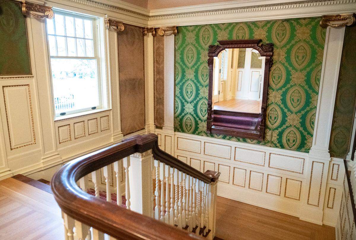 A view of the main stairway after it has been restored in the original Rust Mansion that was built in 1905, in Tacoma, Wash. on Dec. 6, 2022. The mansion has been renovated by real estate developer Ashley Burks, who purchased the property in December 2021.