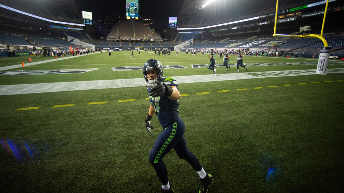 Seattle Seahawks linebacker Cody Barton (57) points to the camera after a play during the fourth quarter. The Seattle Seahawks played the New England Patriots in a NFL football game at CenturyLink Field in Seattle, Wash., on Sunday, Sept. 20, 2020.