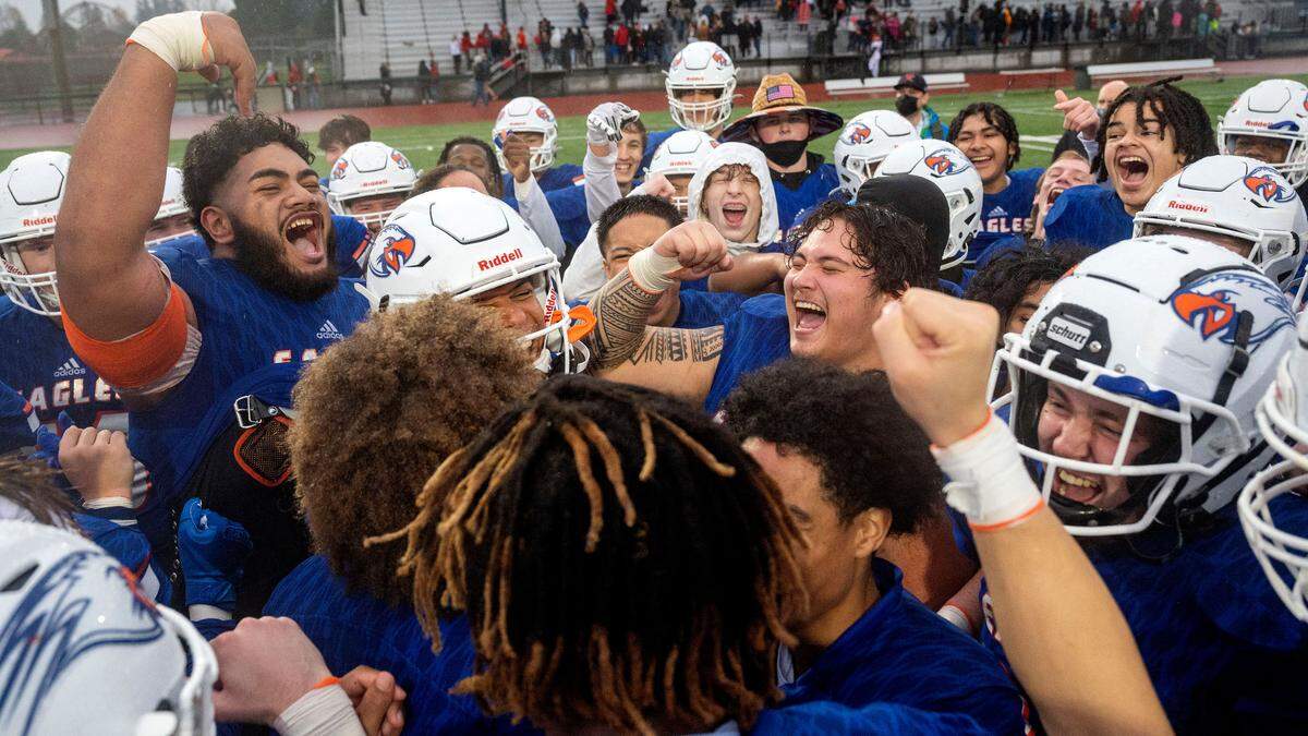 Graham Kapowsin player celebrate after beating Kamiakin, 42-0, in a State 4A semifinal game on Saturday afternoon at Art Crate Field in Spanaway.