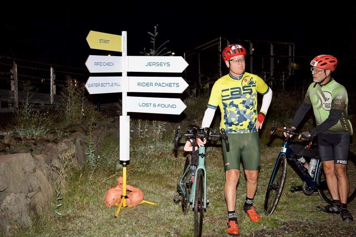 RAMROD 2024 cyclists in the dawn hours waiting to take off in Enumclaw.