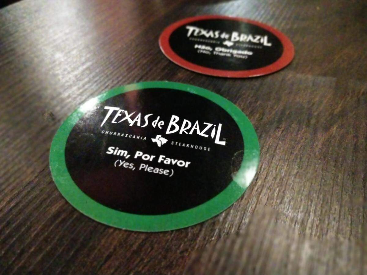 Green means “feed me more meat” and red means “hit the pause button on that meat fest” at Tacoma’s Texas de Brazil.