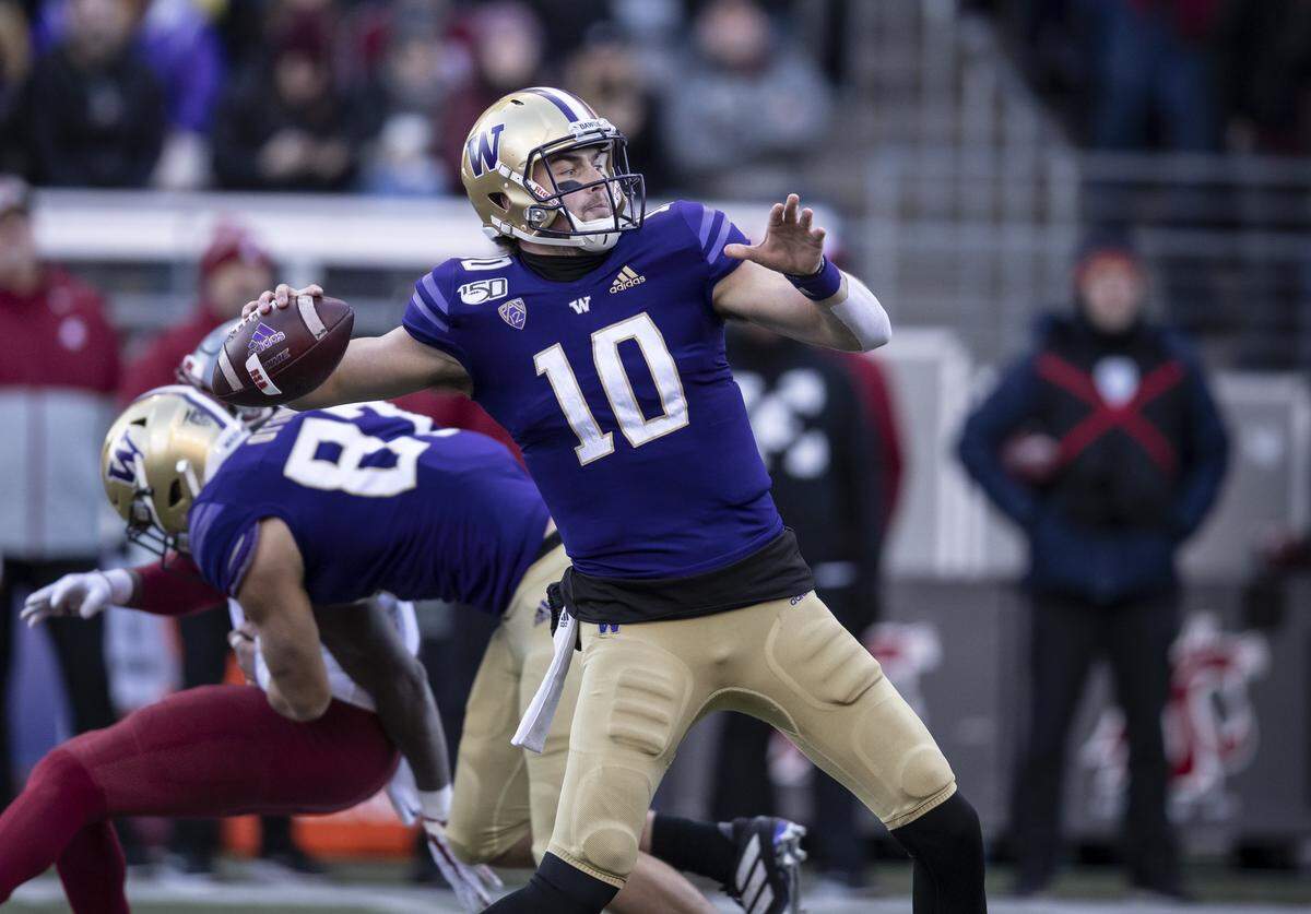 Washington quarterback Jacob Eason passes the ball during the first half of an NCAA college football game against Washington State, on Friday, Nov. 29, 2019 in Seattle. (AP Photo/Stephen Brashear)