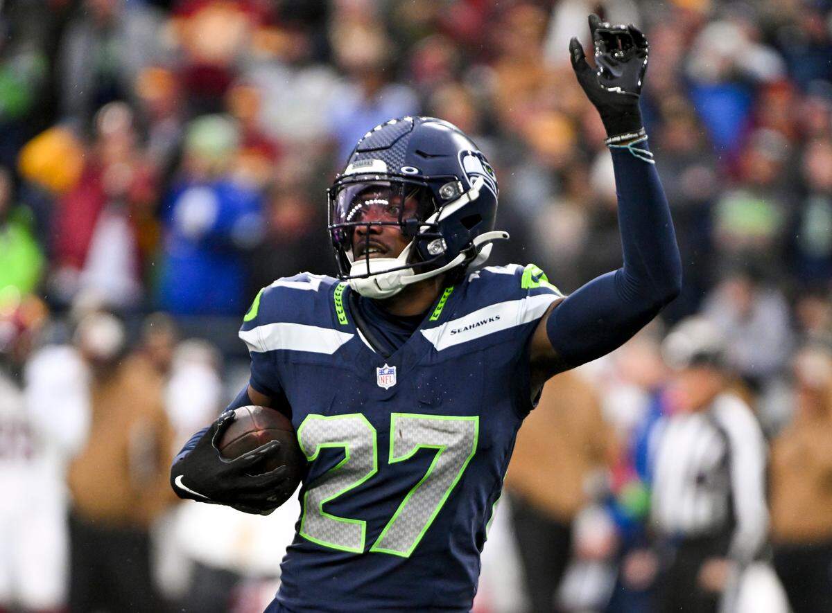 Seattle Seahawks cornerback Riq Woolen (27) reacts to fumble recovery against the Washington Commanders during the third quarter of the game at Lumen Field, on Sunday, Nov. 12, 2023, in Seattle, Wash.