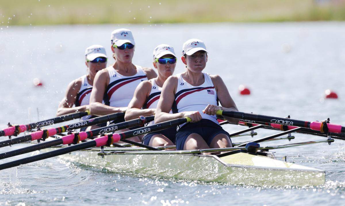 U.S. rowers, right to left, Adrienne Martelli, Megan Kalmoe, Kara Kohler, and Natalie Dell during a women’s rowing quadruple sculls heat in Eton Dorney, near Windsor, at the 2012 Summer Olympics, Saturday, July 28, 2012. (AP Photo/Armando Franca)