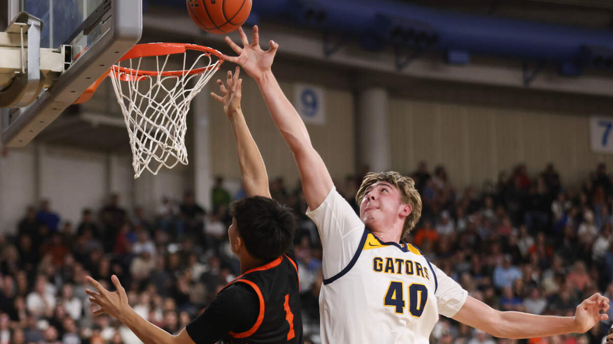 Annie Wright’s Rowan McEvilly blocks a shot by Zillah’s Julian Calzada in the 1A boys state basketball semifinals Friday, March 7, 2025, at the Yakima Valley SunDome in Yakima, Wash.