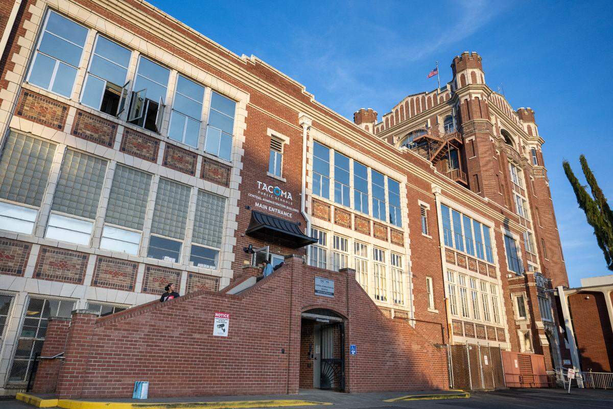 People exit the Tacoma Public Schools Central Administration Building as a board of directors meeting passes the two-hour mark on Thursday, May 22, 2025, in Tacoma.