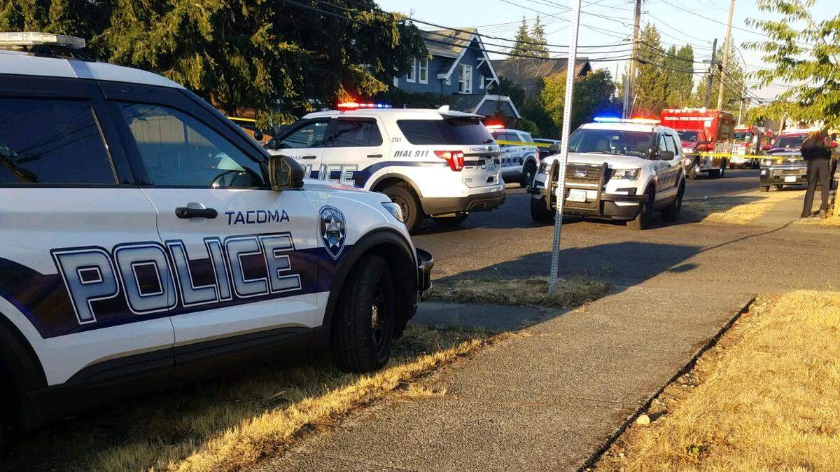 Responders from the Tacoma Police and Fire Departments block off the 3600 block of South 31st Street. Police officers believe a man was shot and killed in the area Wednesday evening. (Tacoma Police Department)
