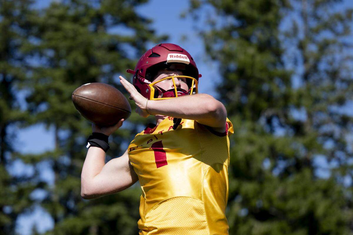 Capital quarterback Nolan Potts throws during a football practice at Capital High School on Friday, Aug. 22, 2025, in Olympia, Wash.