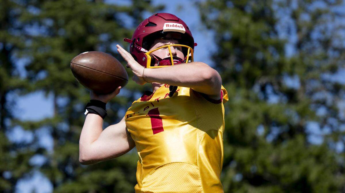 Capital quarterback Nolan Potts throws during a football practice at Capital High School on Friday, Aug. 22, 2025, in Olympia, Wash.