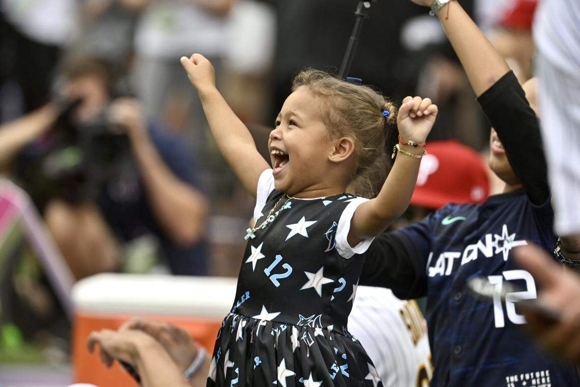 A girl in the crowd smiles at the 2023 MLB Home Run Derby at T-Mobile Park in Seattle on Monday, July 10, 2023.