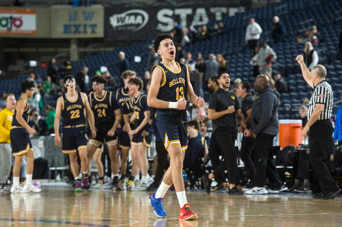 Bellevue guard Bryce Smith (13) celebrates a Wolverines basket in the fourth quarter against Eastside Catholic in the fourth-sixth place game of the Class 3A boys state basketball tournament on Saturday, March 4, 2023 at the Tacoma Dome in Tacoma, Wash.
