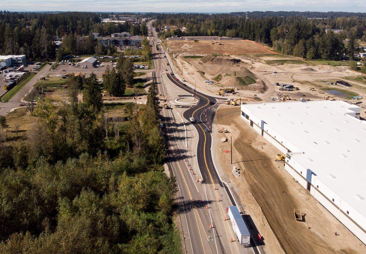 Construction crews work on a roundabout at State Route 410 and 224th Avenue East, on Tuesday, Oct. 1, 2024, in Bonney Lake.